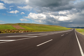 Highway. Open views and sunny weather to travel.