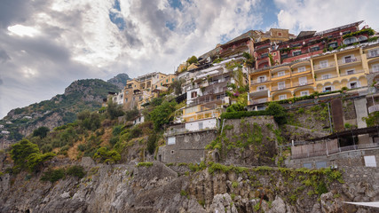 Fototapeta na wymiar Buildings on a cliff in Positano town in Italy