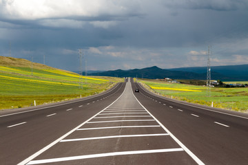 Highway. Open views and sunny weather to travel.