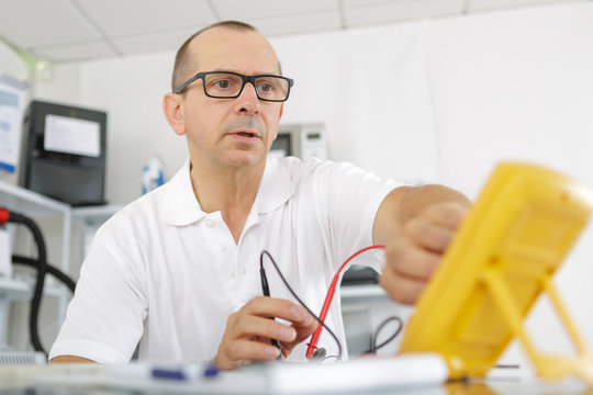 electrician working on an electric meter