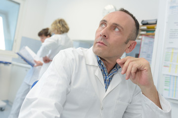 Fototapeta na wymiar portrait of pharmacist in lab coat at pharmacy