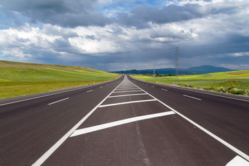 Highway. Open views and sunny weather to travel.