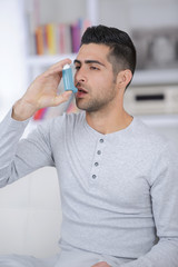 man suffering from asthma following a treatmen