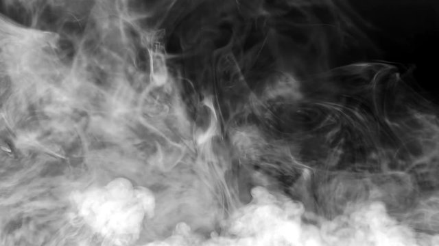 White smoke swirls against a black background