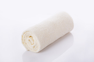 Fototapeta na wymiar White towel roll on white background