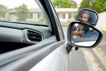young woman getting a driving lesson in the car