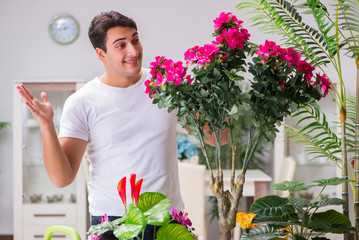Young man in gardening concept at home