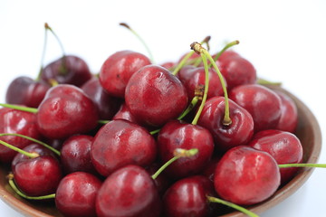 The big cherries are on a white background