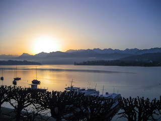 Swiss sunrise over mountains and lake in Lucerne