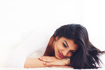Obraz premium portrait of beautiful young indian woman on carpet