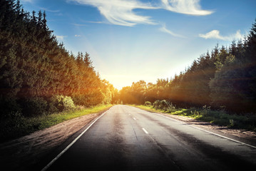 Fototapeta premium Sunrise beautiful road in forest
