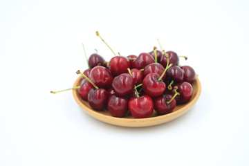The big cherries are on a white background