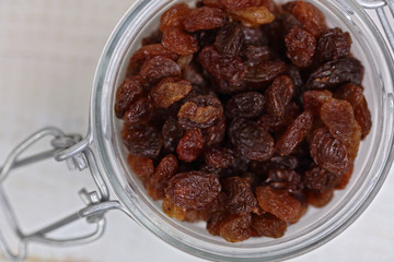 Dark raisins in a bowl close up. Nutrition, healthy eating concept