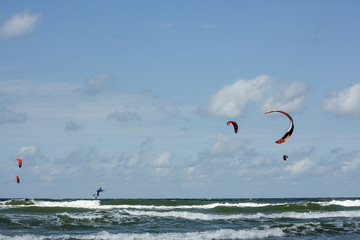 kiteboarders un baltic beach, latvia, ventspils kiteparty summer