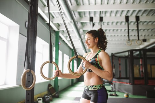 dip ring beutiful girl woman muscle ups rings workout at gym