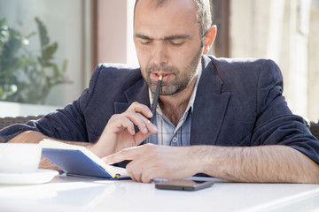 Time management concept. businessman planning his workday (Freedom, freelance, success, money)