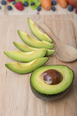 Avocado on wood table ,Healthy food concept