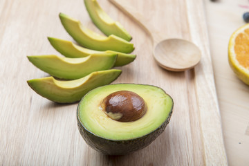 Avocado on wood table ,Healthy food concept