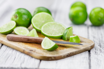 Lime Slices (selective focus) on vintage wooden background
