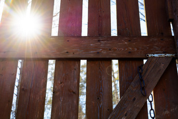 Sunlight through wooden gate