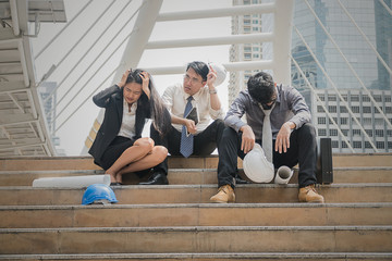 Team business people sitting on stairs senses fail.