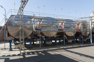 Modern aluminum barrels for wine in wine factory photo