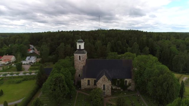 Old medieval stone church, Cinema 4k aerial view around kemio church, on a summer day, in Kemionsaari, varsinais-suomi, Finland