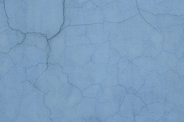 Obraz premium Texture of the old wall with cracks painted in blue.