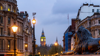 London Trafalgar Square lion and Big Ben tower at background, London, UK