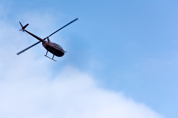 Naklejka na ściany i meble Helicopter in flight