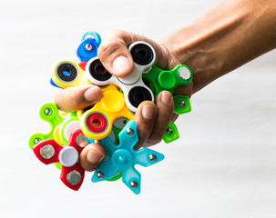 Hand spinners in hand.
