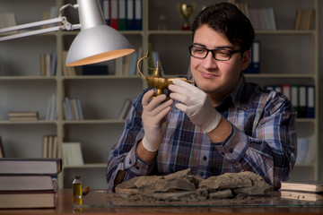 Archeologist working late night in office