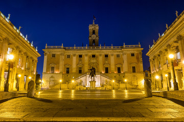 Fototapeta na wymiar Italy Rome Capitoline hill city square museum buildings and statue illuminated at sunrise
