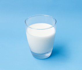 Glass of milk on blue background, food and drink for healthy concept