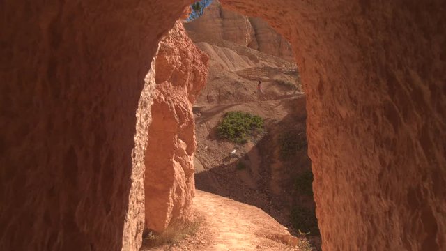 Girl traveler walking up the switchback path exploring amazing Bryce canyon national park in sunny Utah