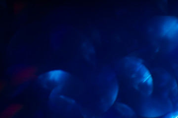 Blue blurred lights abstract background. Sparkles shine glitter backdrop. Christmas wallpaper decorations concept