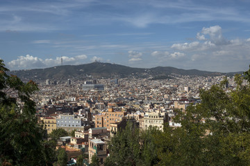 Fototapeta na wymiar City of Barcelona with Tibidabo Mountain in far distance