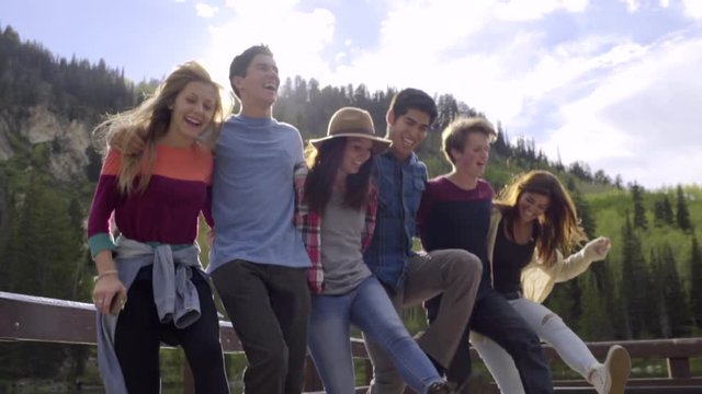 Group Of Happy Teens, Hold Each Other, Dance In A Row (Slow Motion)
