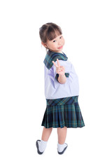 Little Asian schoolgirl smiling over white background