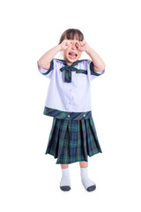 Little asian schoolgirl crying over white background