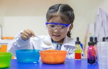 asian kid learn chemical lab