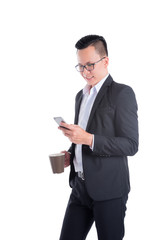 Young asian businessman reading message on cellphone over white background