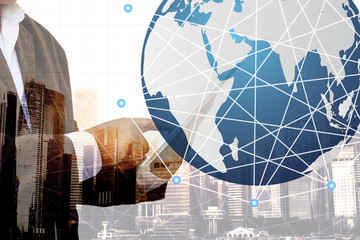 Double exposure of success businessman using tablet with blurred and bokeh of shopping mall background, Concept shopping online with internet.