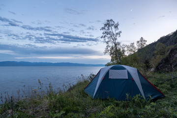 Tourist tent on the shore of Lake Baikal