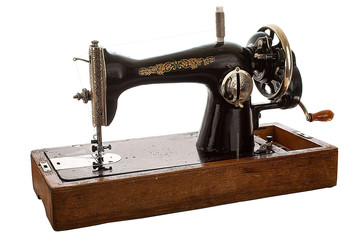 An old, hand sewing machine on white background