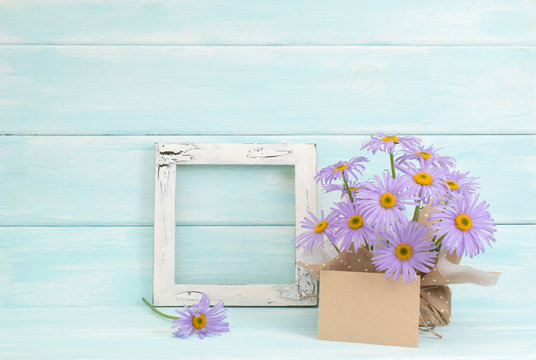 Chamomile, photo frame and paper