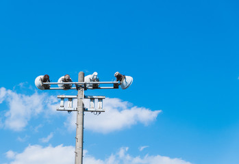 broadcast tower in the village on blue sky background