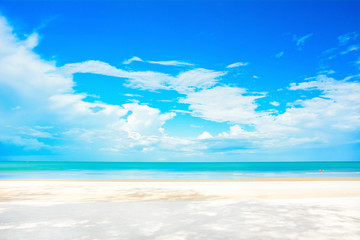 Fototapeta na wymiar Beautiful white sand beach in summer blue sky background