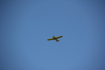 Fototapeta na wymiar Airplane in the sky of South Beach / South Pointe Beach, Miami, Florida, USA