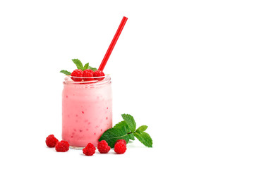 Mug of raspberry smoothie and berries of ripe raspberry on a white background.
